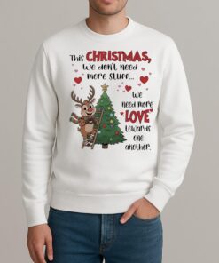 This Christmas We Dont Need More Stuff We Need More Love Premium sweater